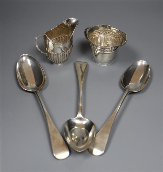 A late Victorian silver half fluted cream jug, an Edwardian silver cream jug & three Victorian silver tablespoons, 10oz.